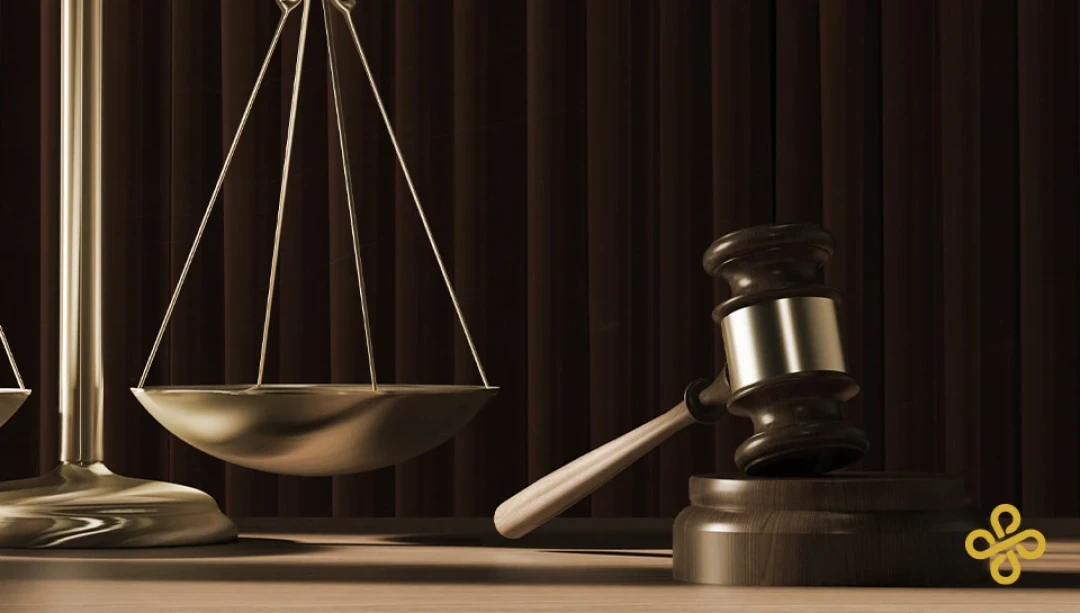 Balance scales alongside a gavel