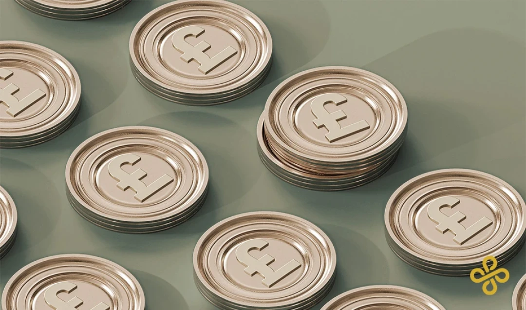 Laid out coins with the British pound symbol embossed on them